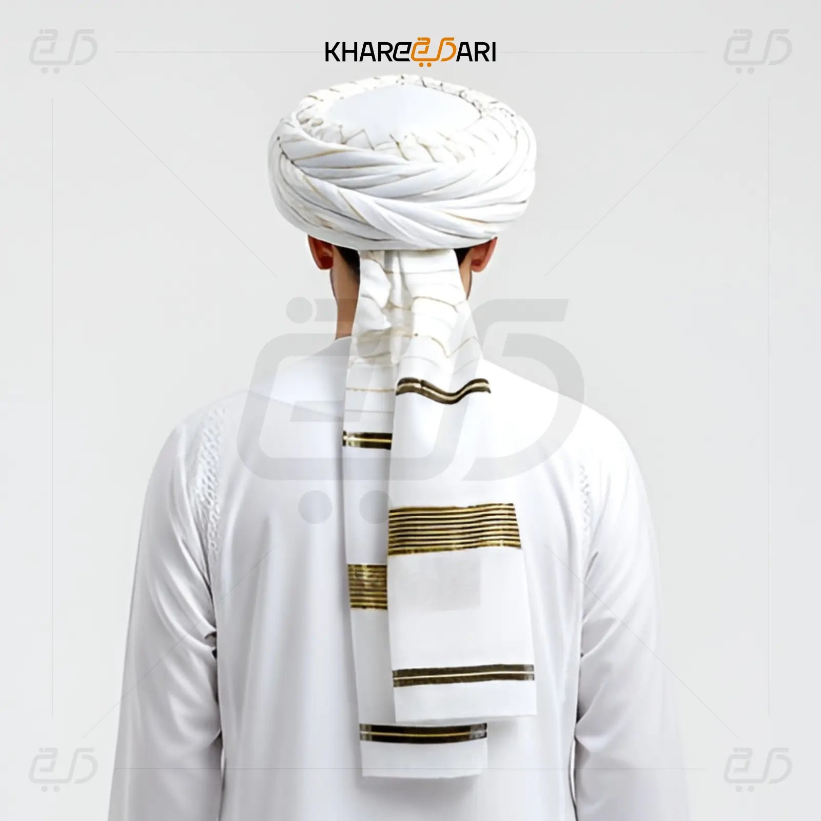 Person wearing a white thobe with a matching white turban on a light gray background, featuring the brand 'Khareeb Dari'. White with Golden Line
