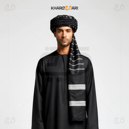 Man wearing a black outfit with a matching turban and scarf on a light gray background, featuring the brand 'Khareeb Dari'. Black with White Line
