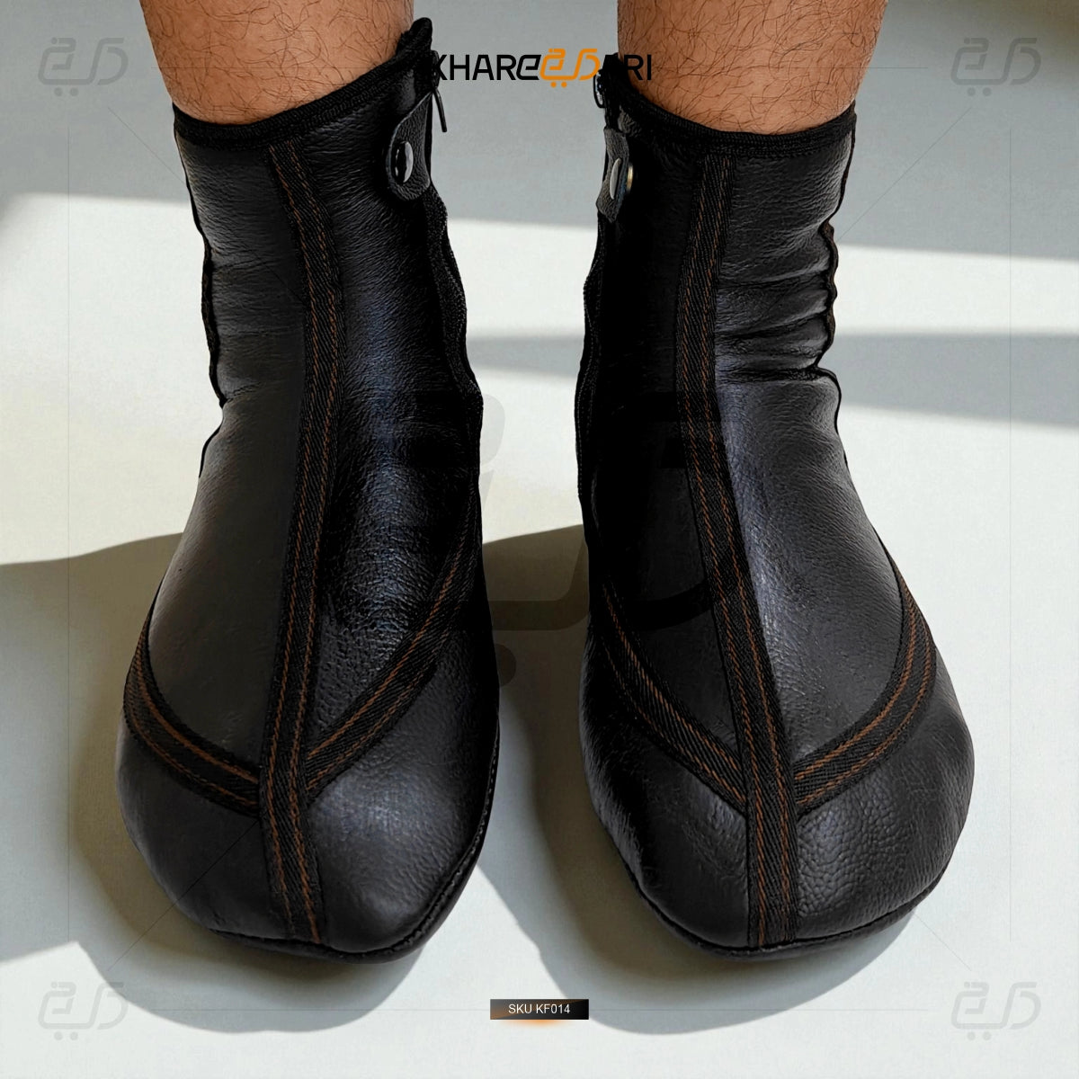Black leather ankle boots on a white background Black