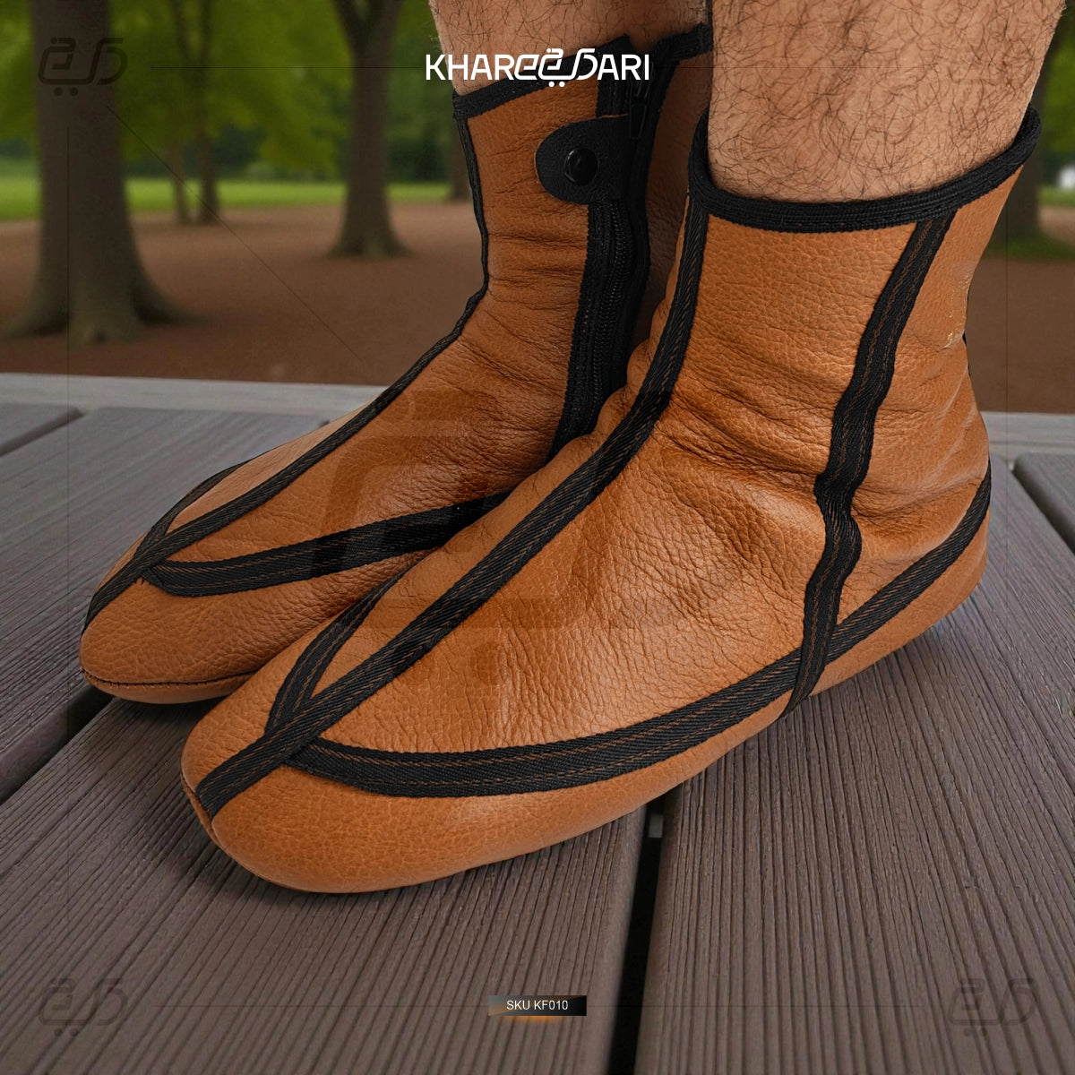 Brown leather shoes with black straps on a wooden surface, brand 'Khareebari' visible. Brown