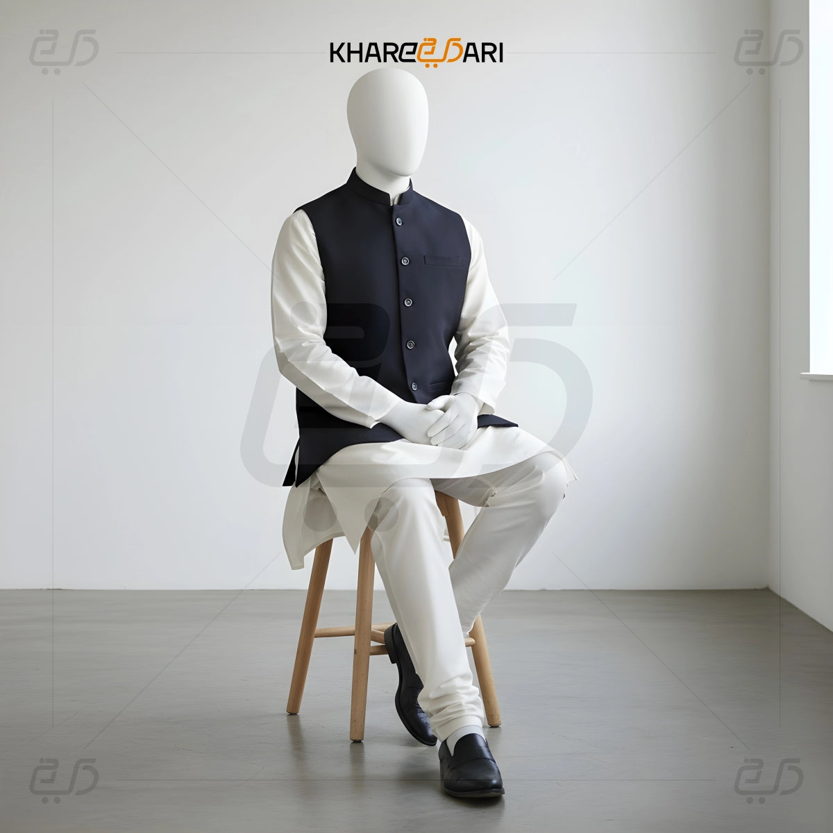 Mannequin wearing a traditional outfit with a vest and white shirt on a stool against a plain background, branded 'Khareeb Dari'. Black
