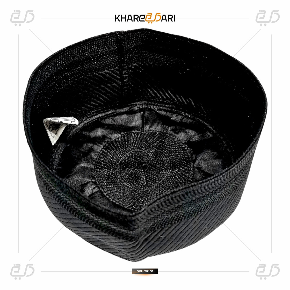 Black embroidered cap with a decorative emblem on a white background, featuring the brand 'Khareebari'. Black