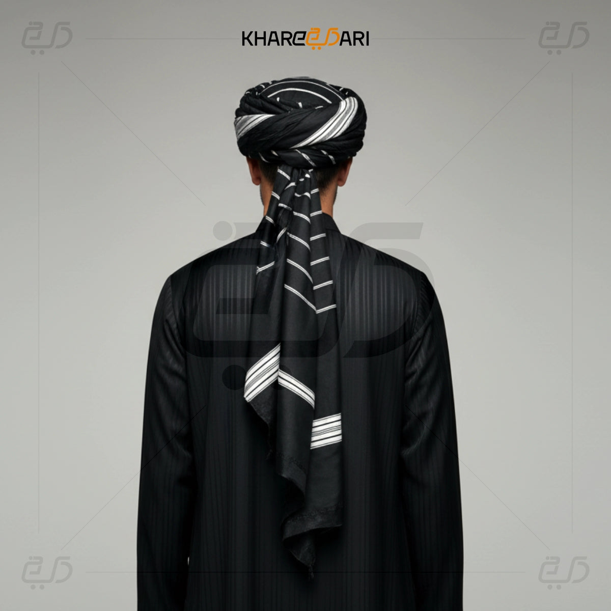 Person wearing a black traditional outfit with a matching turban on a gray background, branded 'Khareezdari'. Black with White Line