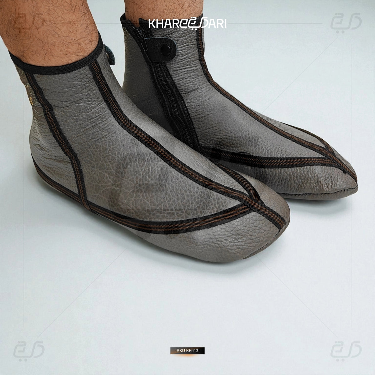 Gray shoes with black accents on a white background, featuring the brand 'Khareedari'. Grey