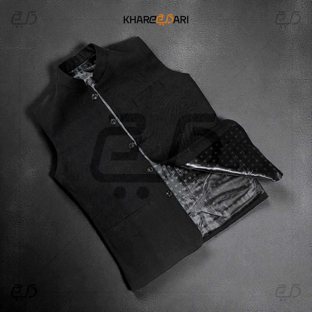 Black coat with open front on a gray background, featuring the brand 'Khareeb Dari'. Black