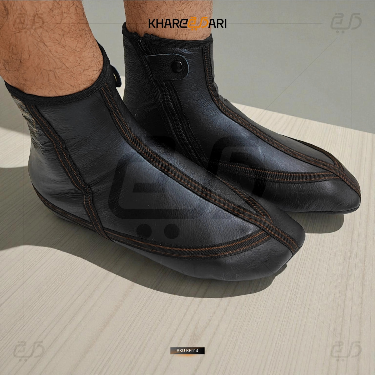 Black shoe covers on feet with 'Khareebari' branding on a light background Purple