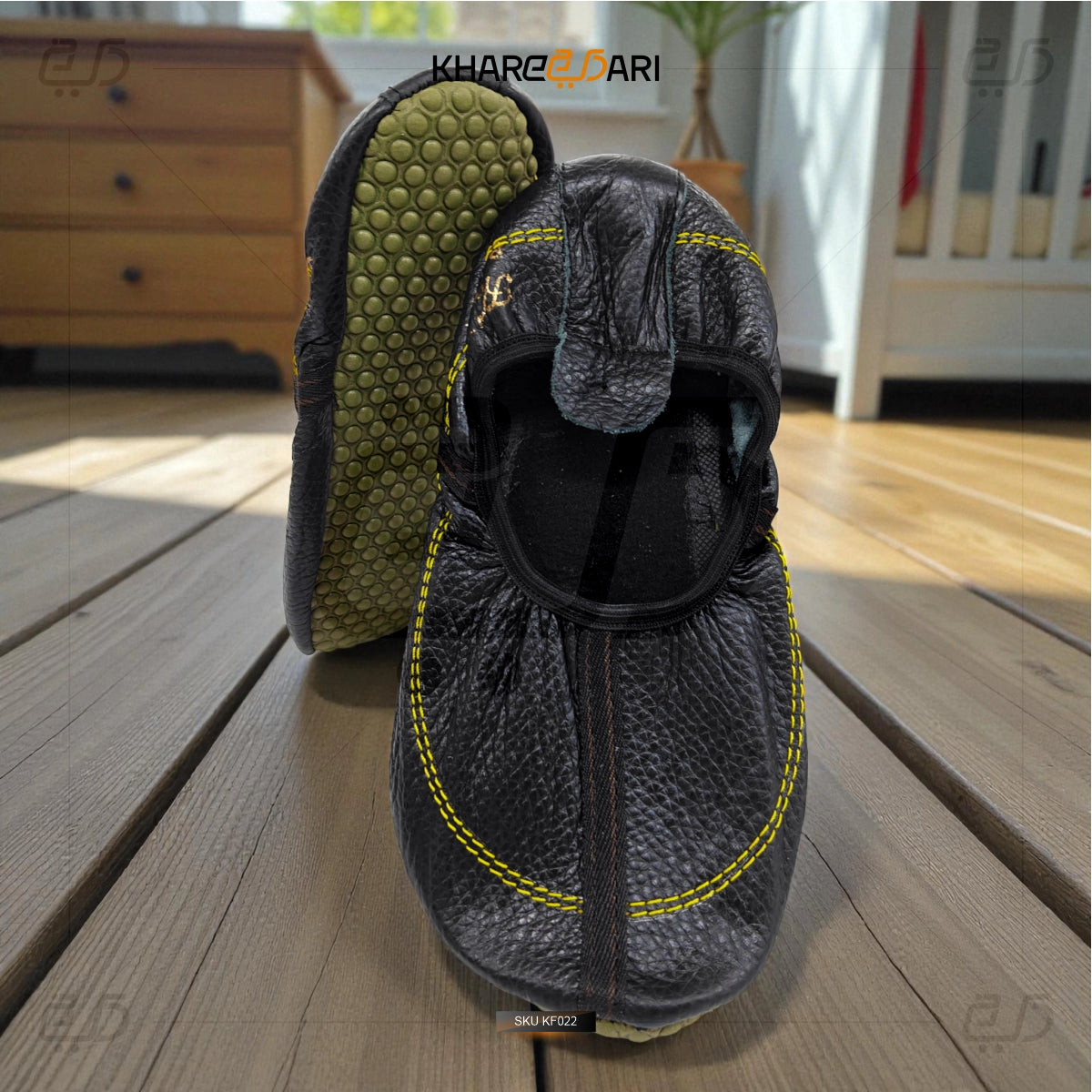 Gray slip-on shoes with textured sole on a wooden floor, brand 'Khareedari' visible. Black