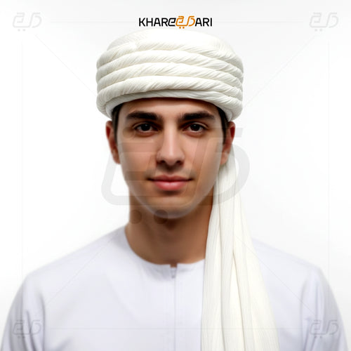 Man wearing a white turban with 'Khareeb Dari' branding on a white background White