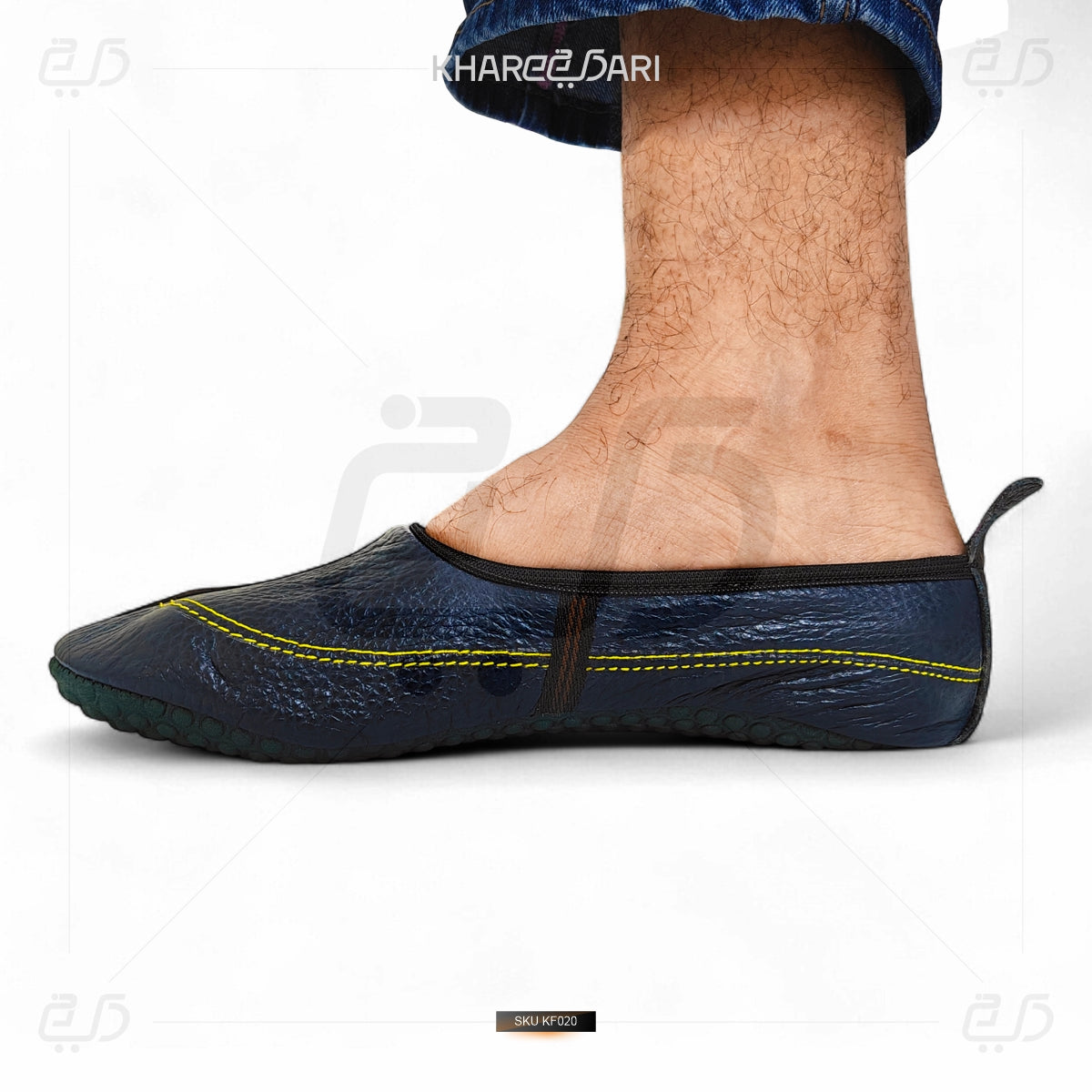 Black slip-on shoe with yellow stitching on a white background Purple