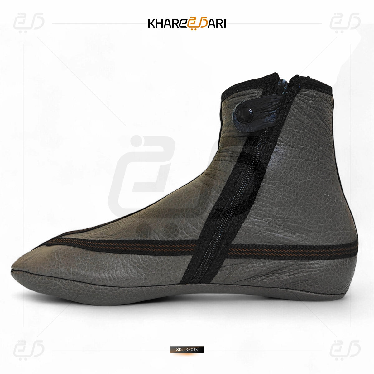 Gray shoe cover with black straps on a white background, branded 'Khareebari'. Grey